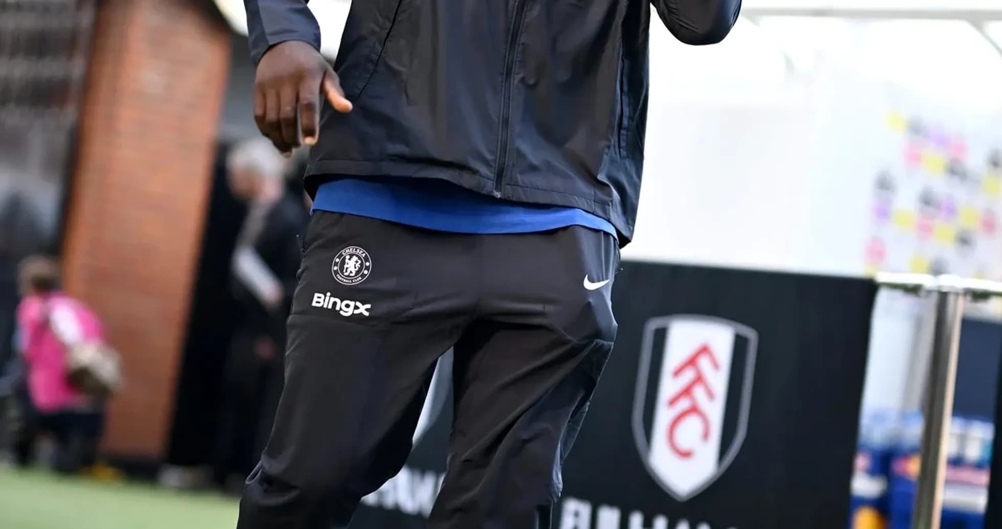 Player walking in Chelsea training gear before match