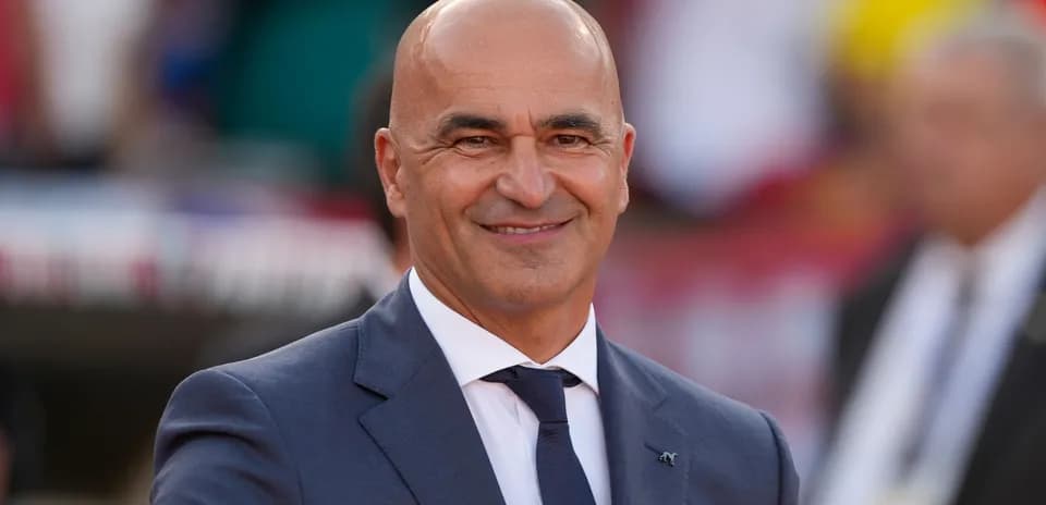 Man in suit smiling at the camera