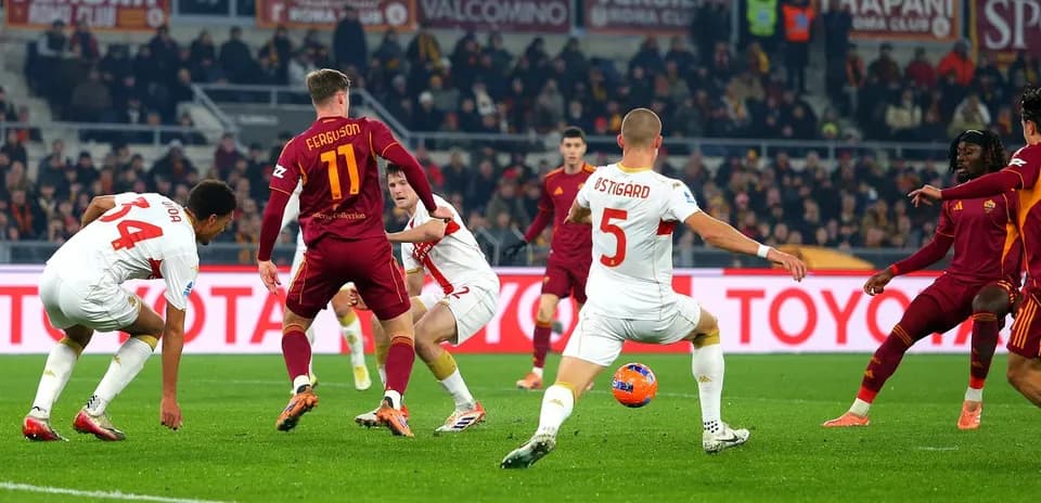 Genoa and AS Roma players in action