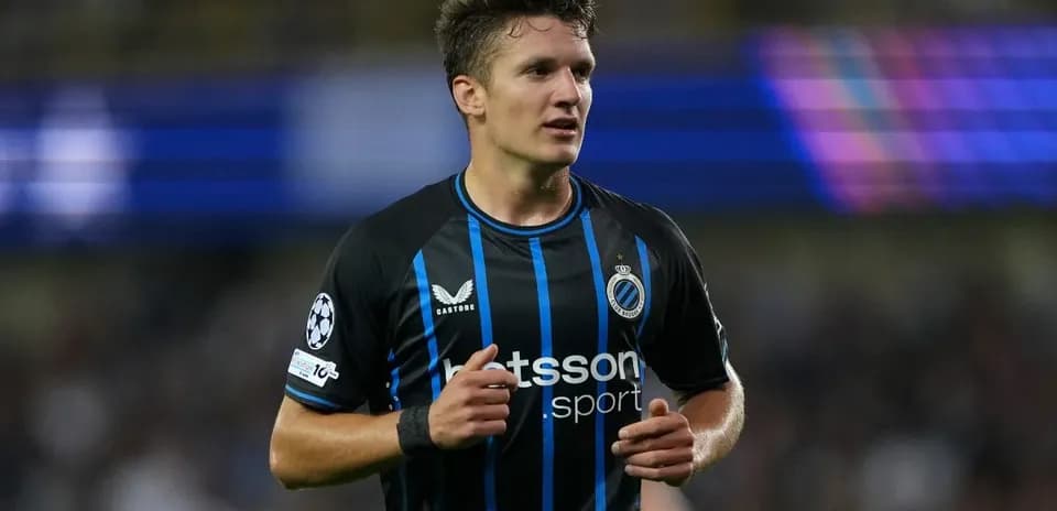 Player in black and blue jersey during match