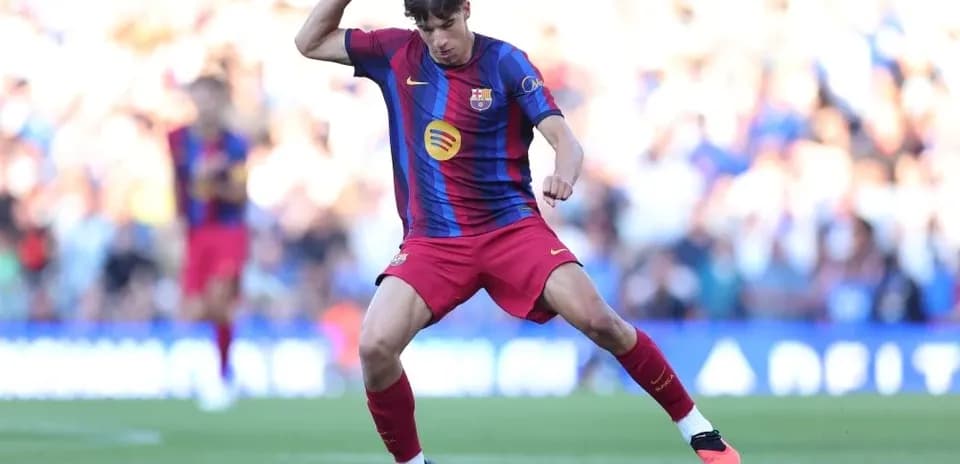 Player in Barcelona kit dribbling the ball