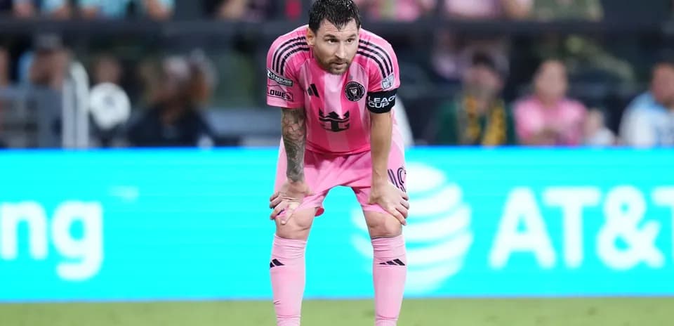 Player in pink jersey resting during match