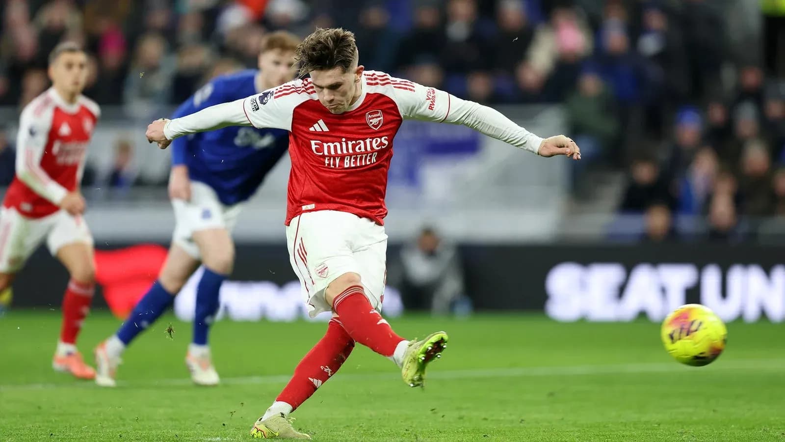 Arsenal player kicking the ball during match