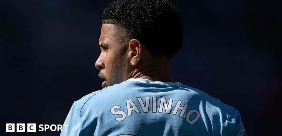Player wearing light blue jersey with 'SAVINHO' on back