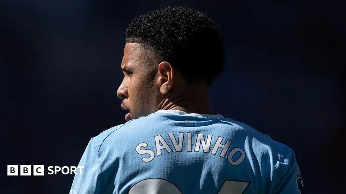 Player wearing light blue jersey with 'SAVINHO' on back