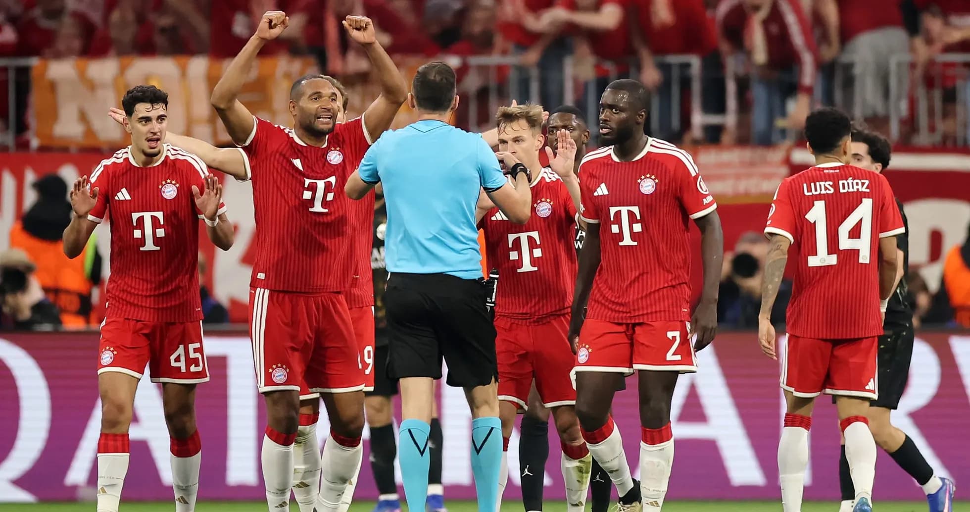 Bayern players arguing with referee during match