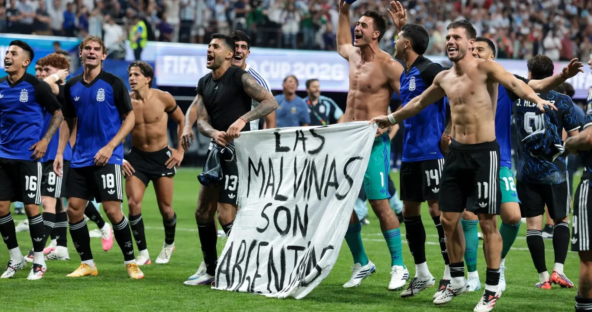 Argentinian players celebrating with banner after victory