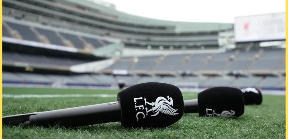 Microphones with Liverpool FC logo on pitch