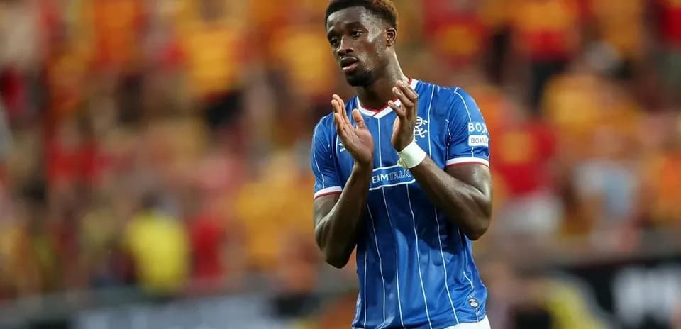 Rangers player applauding fans during match