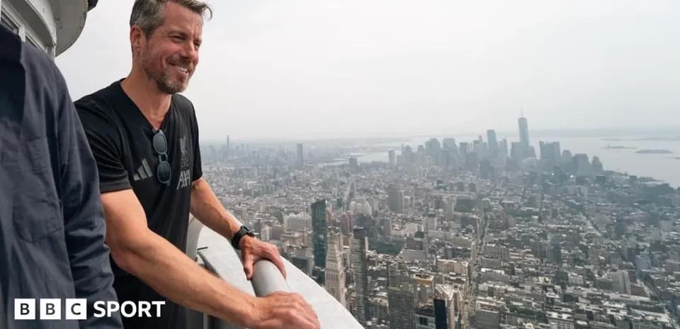 Person overlooking New York City skyline from height
