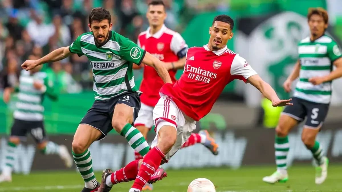 Player challenge during Sporting CP vs Arsenal match