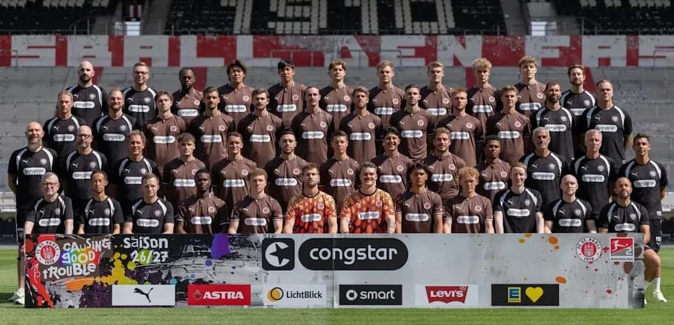 Team photo of St. Pauli players in stadium