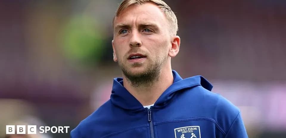 Player in West Ham United hoodie before match