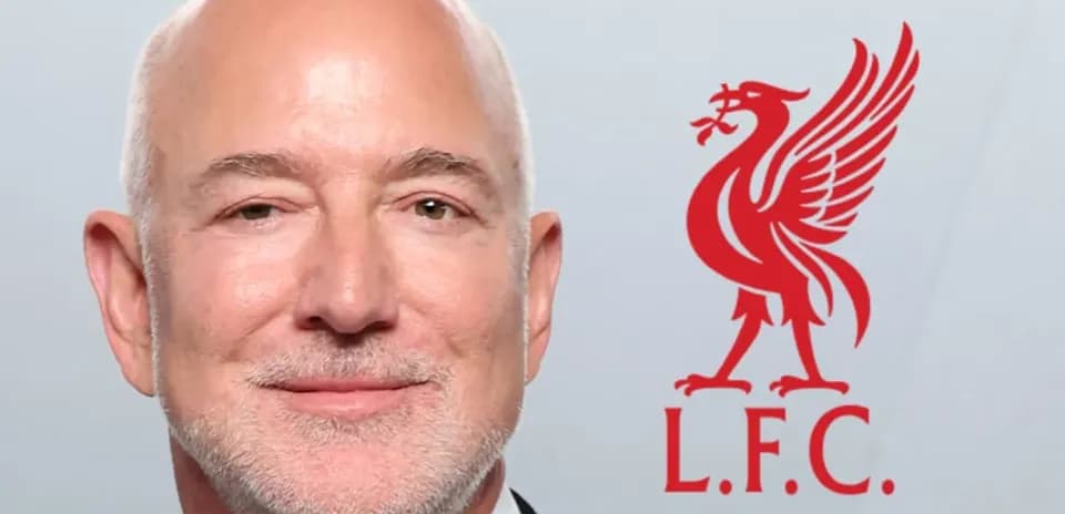 Person smiling next to Liverpool FC logo