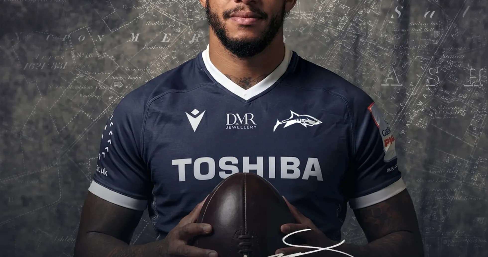 Courtney Lawes posing with a rugby ball