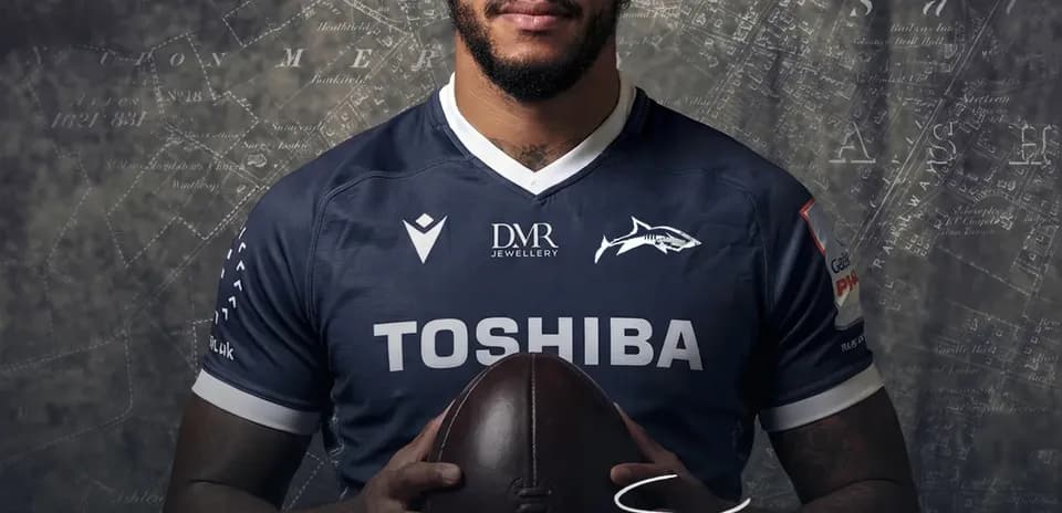 Courtney Lawes posing with a rugby ball