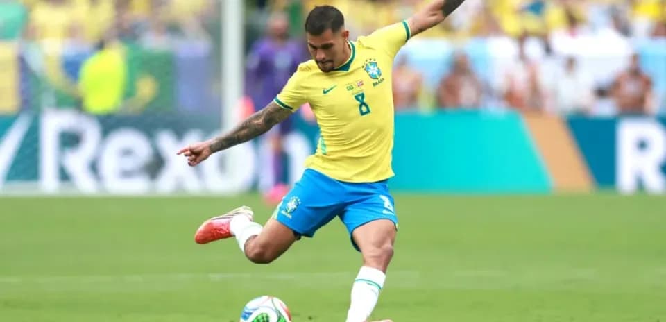 Brazilian player kicking soccer ball during match