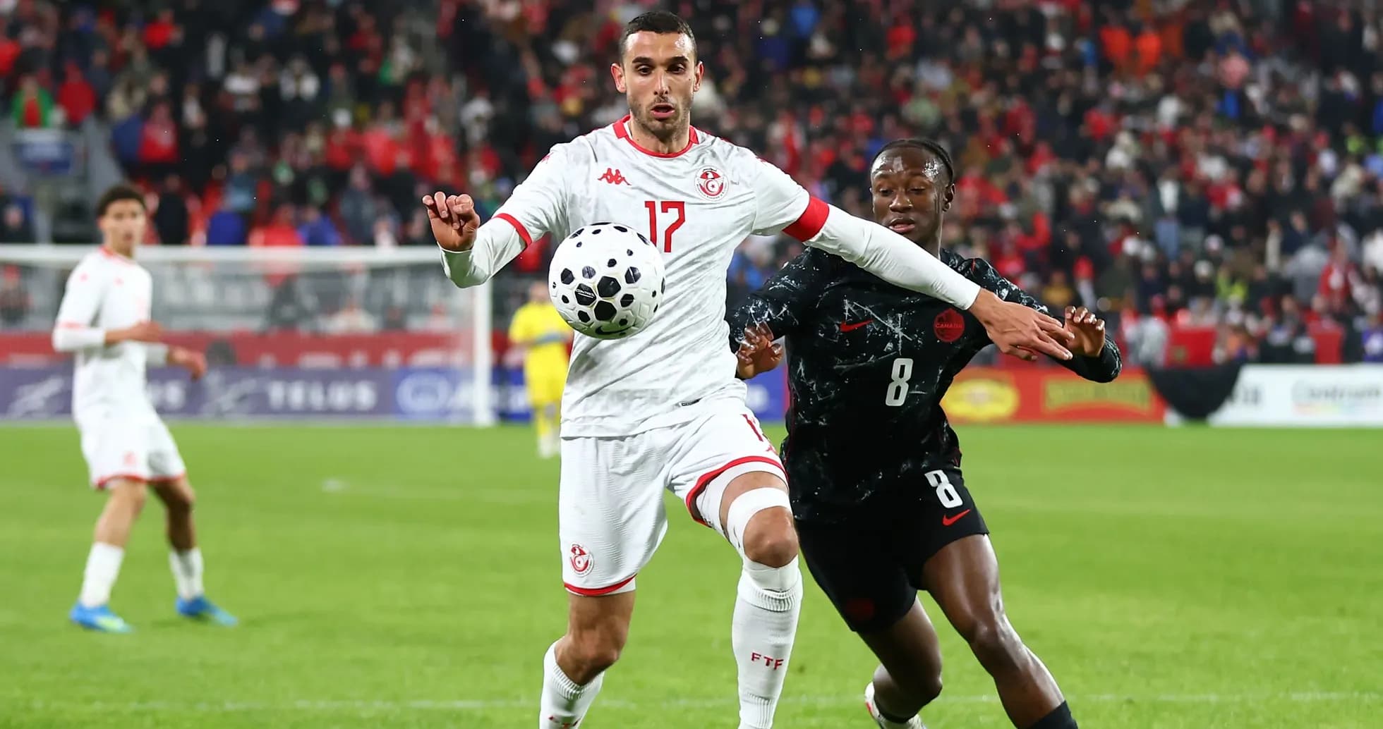 Player from Tunisia controls ball under pressure