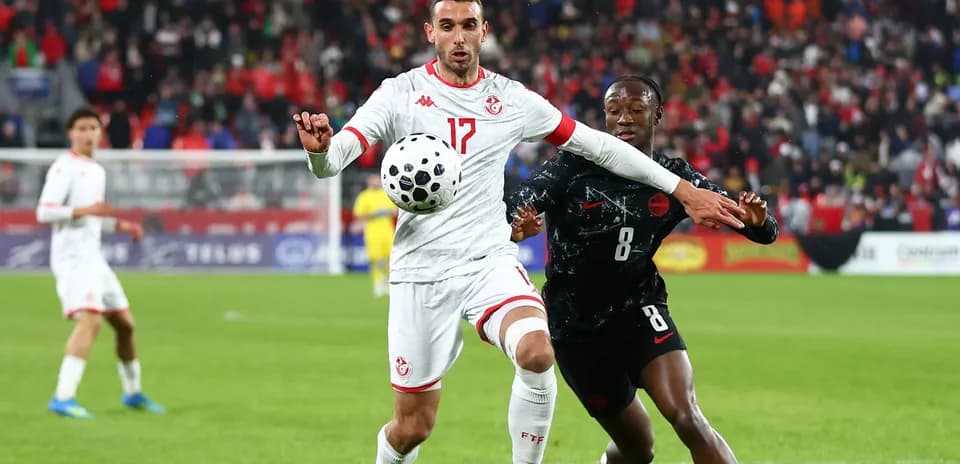 Player from Tunisia controls ball under pressure