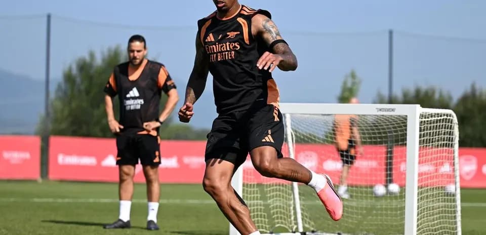 Player dribbling football during training session