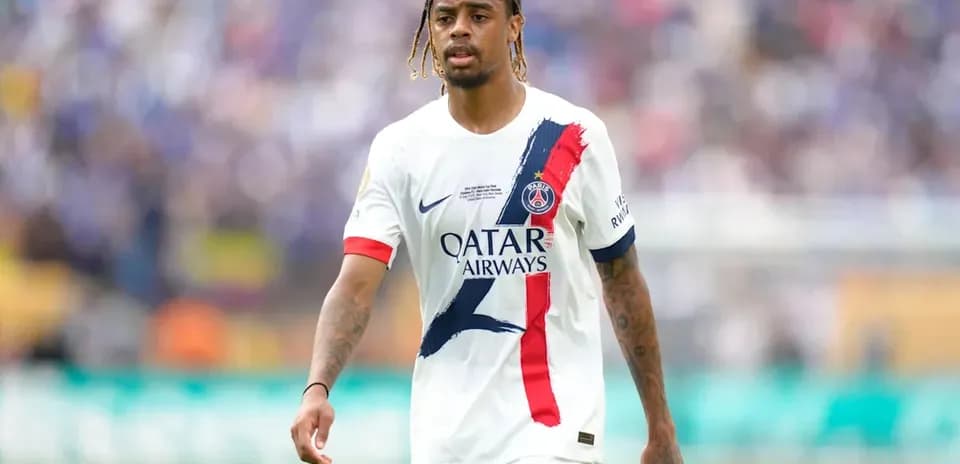 Player walking on pitch in PSG uniform