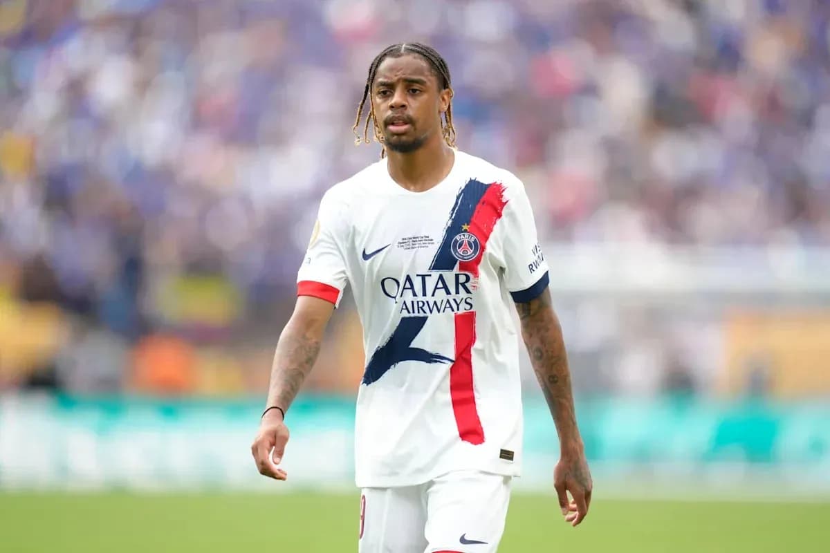 Player walking on pitch in PSG uniform