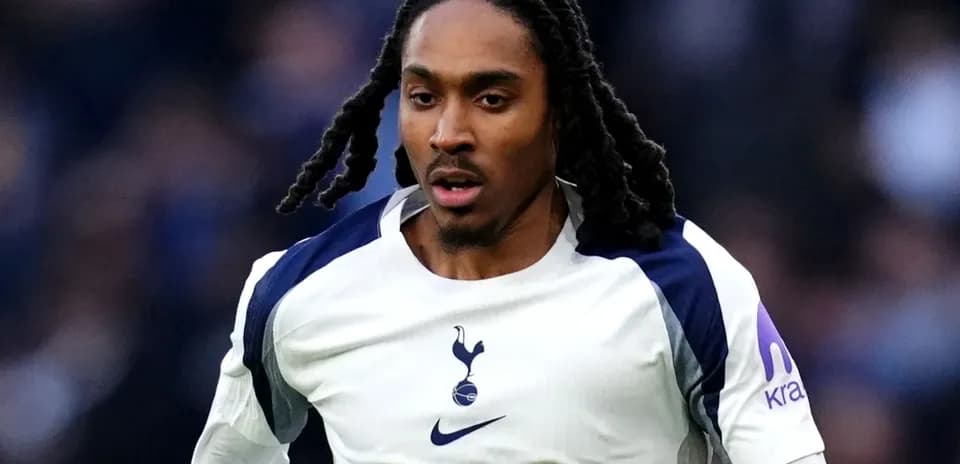 Player in Tottenham kit running on the field