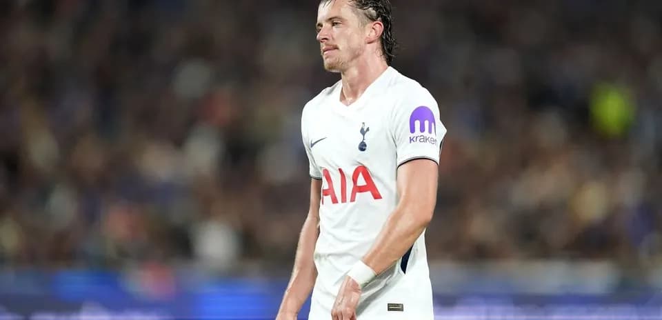 Tottenham player walking on pitch during match