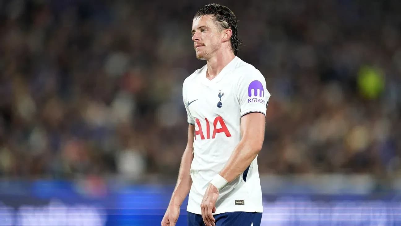 Tottenham player walking on pitch during match