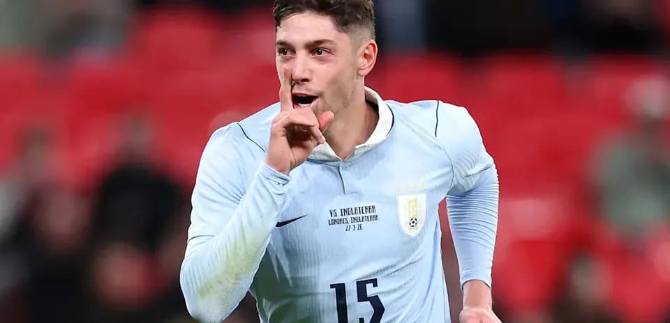 Player celebrating with finger to lips in stadium