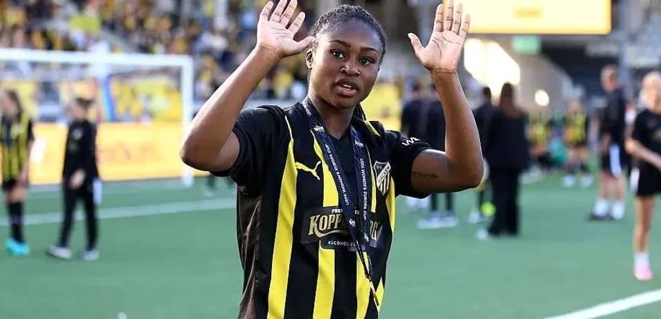 Player waving on the field after match celebration