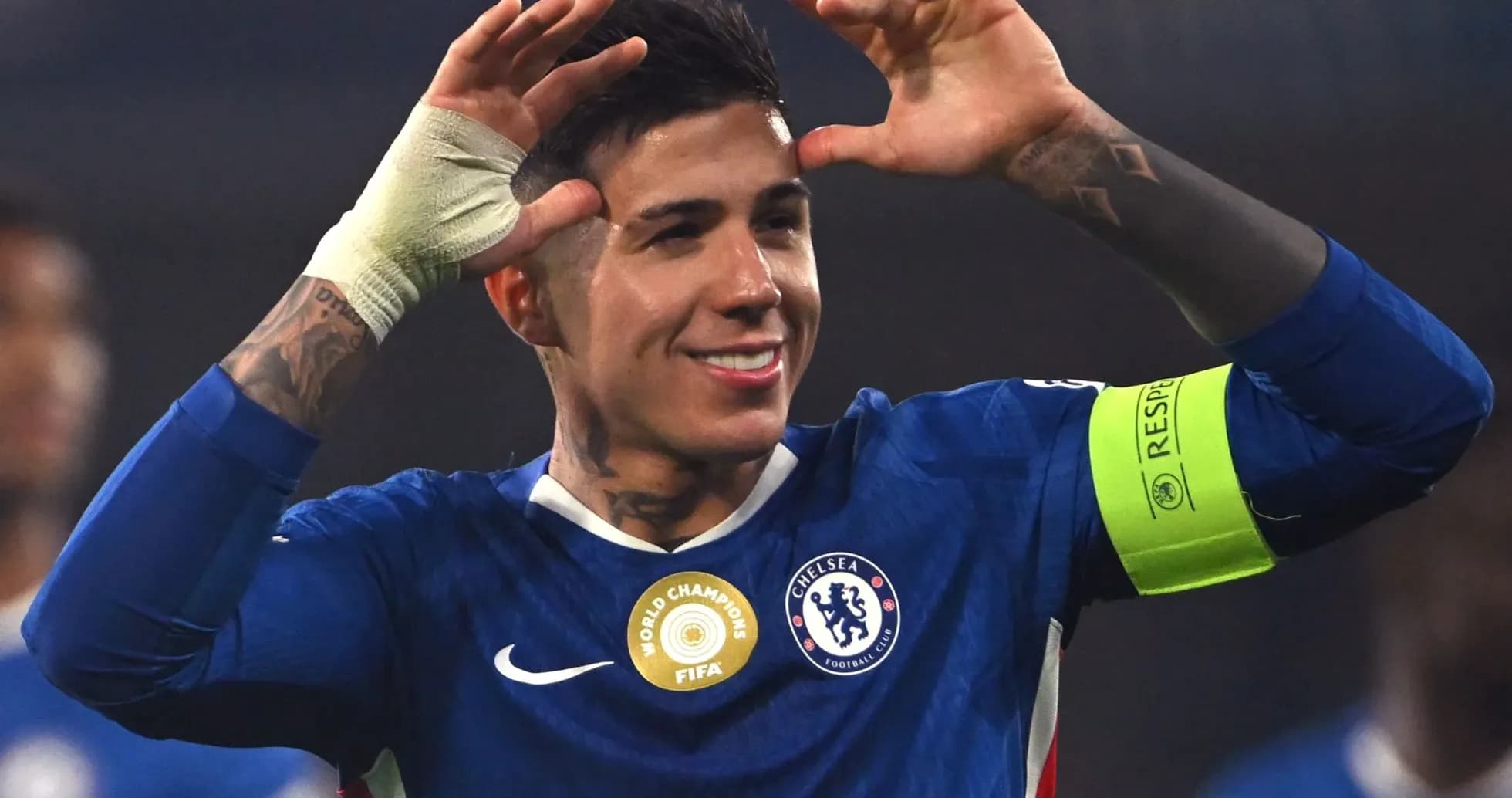 Player celebrating in Chelsea kit with captain's armband