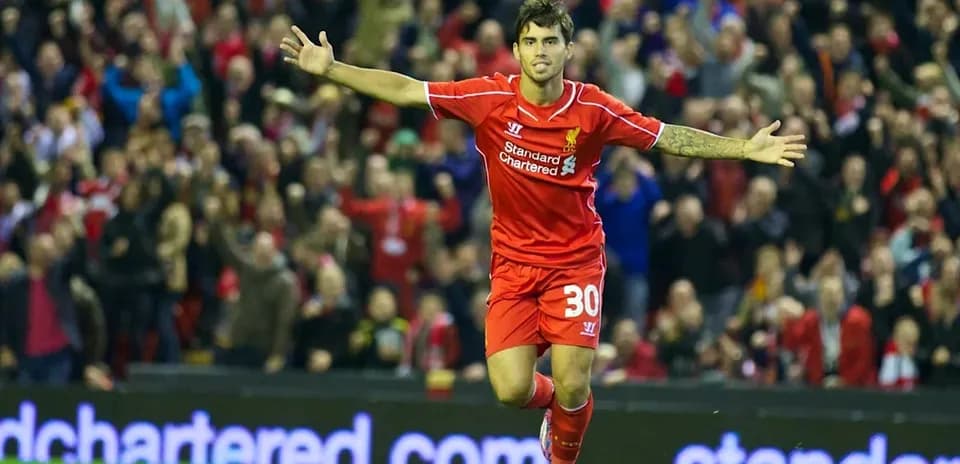 Player celebrating a goal at Anfield stadium