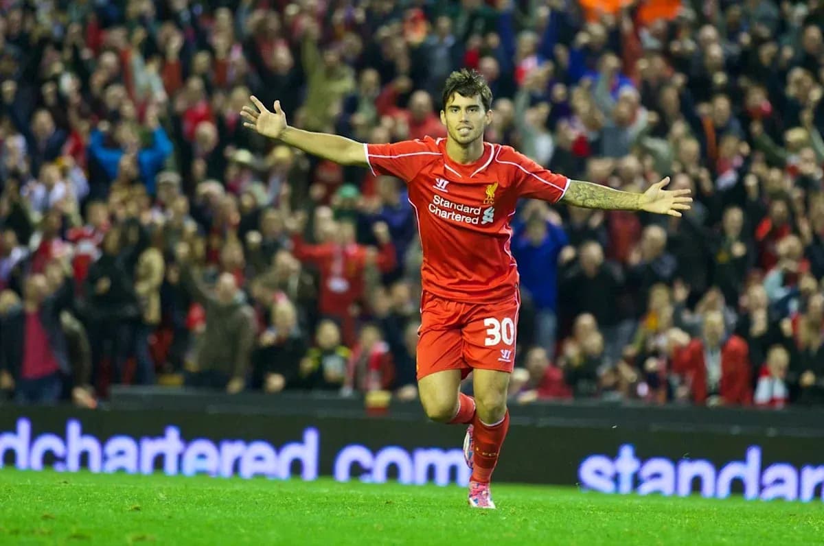 Player celebrating a goal at Anfield stadium
