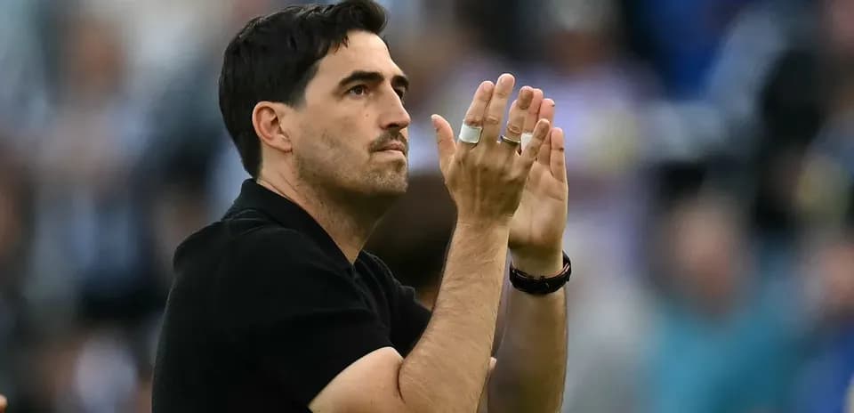 Coach applauding during a match or event