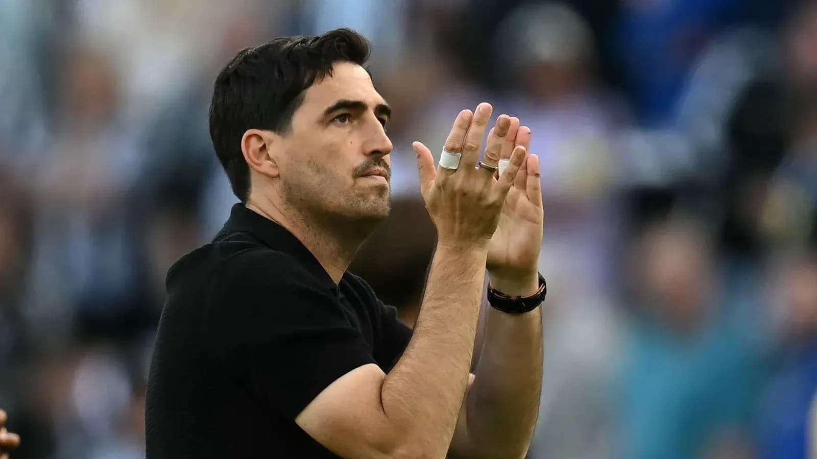 Coach applauding during a match or event