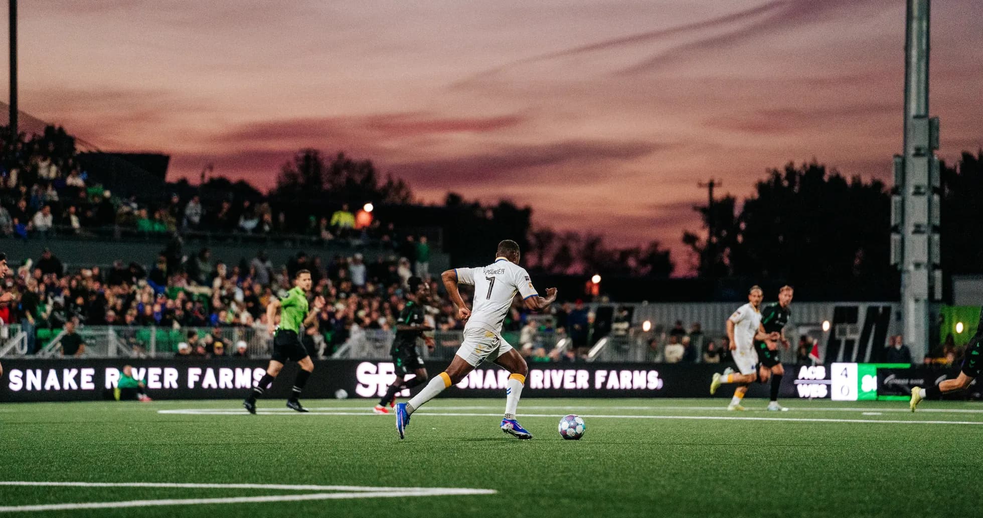 Player dribbling the ball during USL match