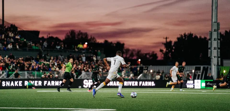 Player dribbling the ball during USL match