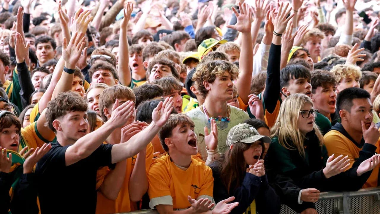 Crowd of fans cheering at sports event