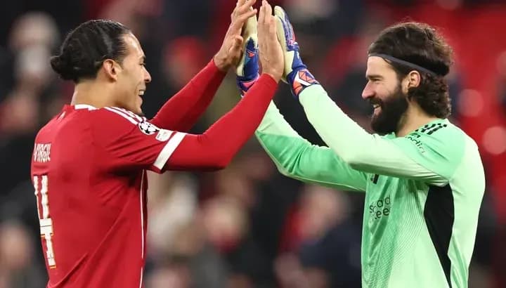 Players celebrating with high fives after match