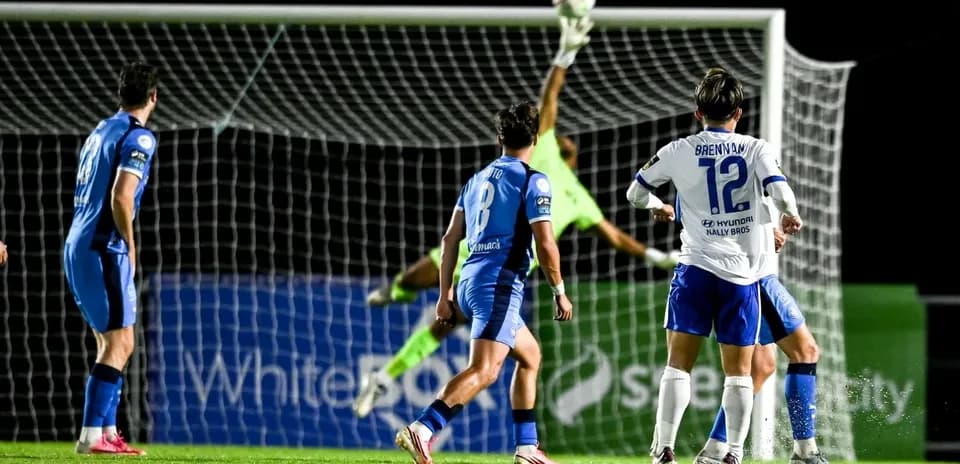 Goalkeeper making a save during soccer match