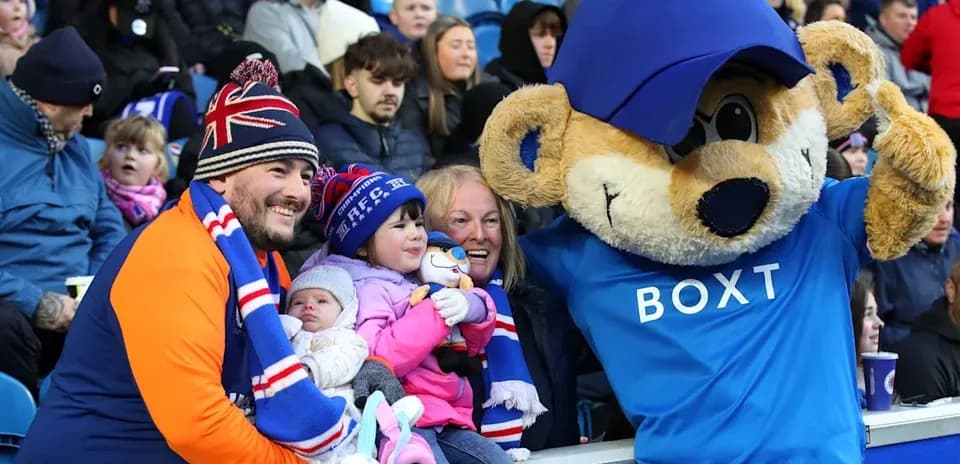 Family with mascot at a sports event