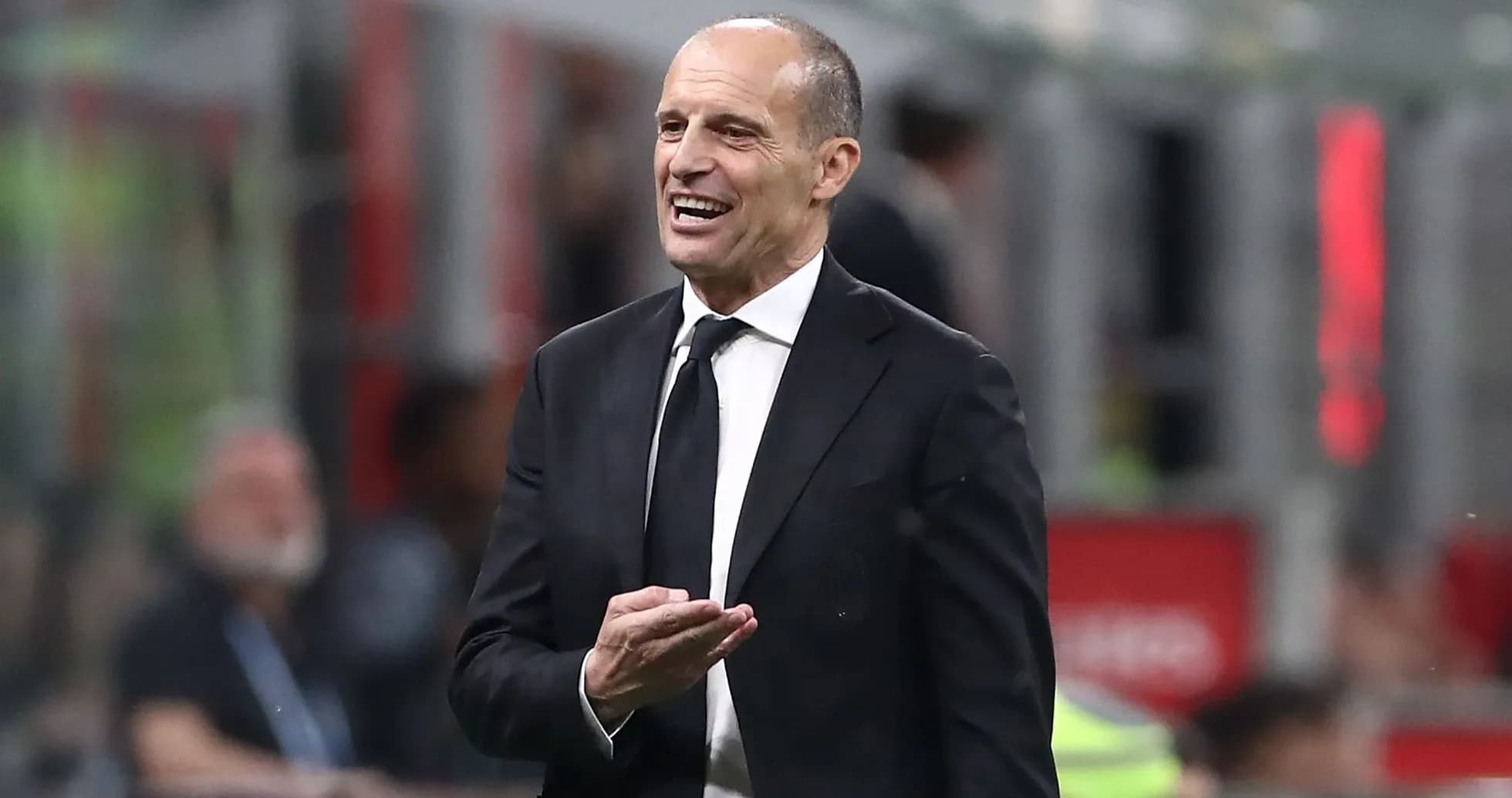 Coach gesturing during a match from the sideline