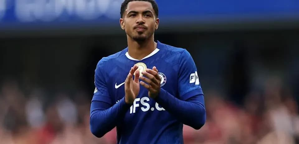Player applauding fans wearing blue team jersey