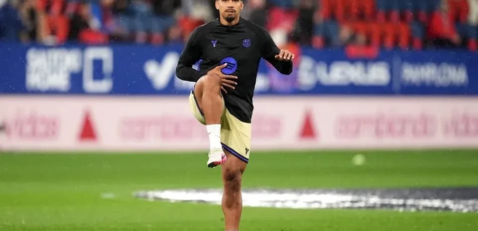 Player stretching during warm-up on pitch