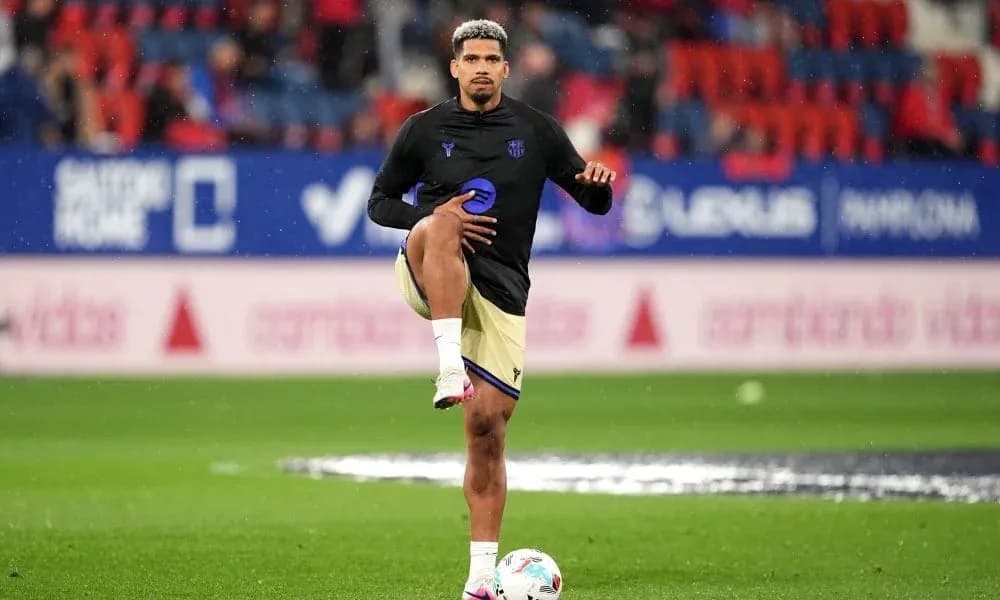 Player stretching during warm-up on pitch