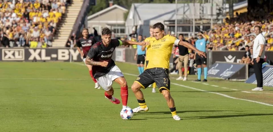 Players contesting for the ball in match