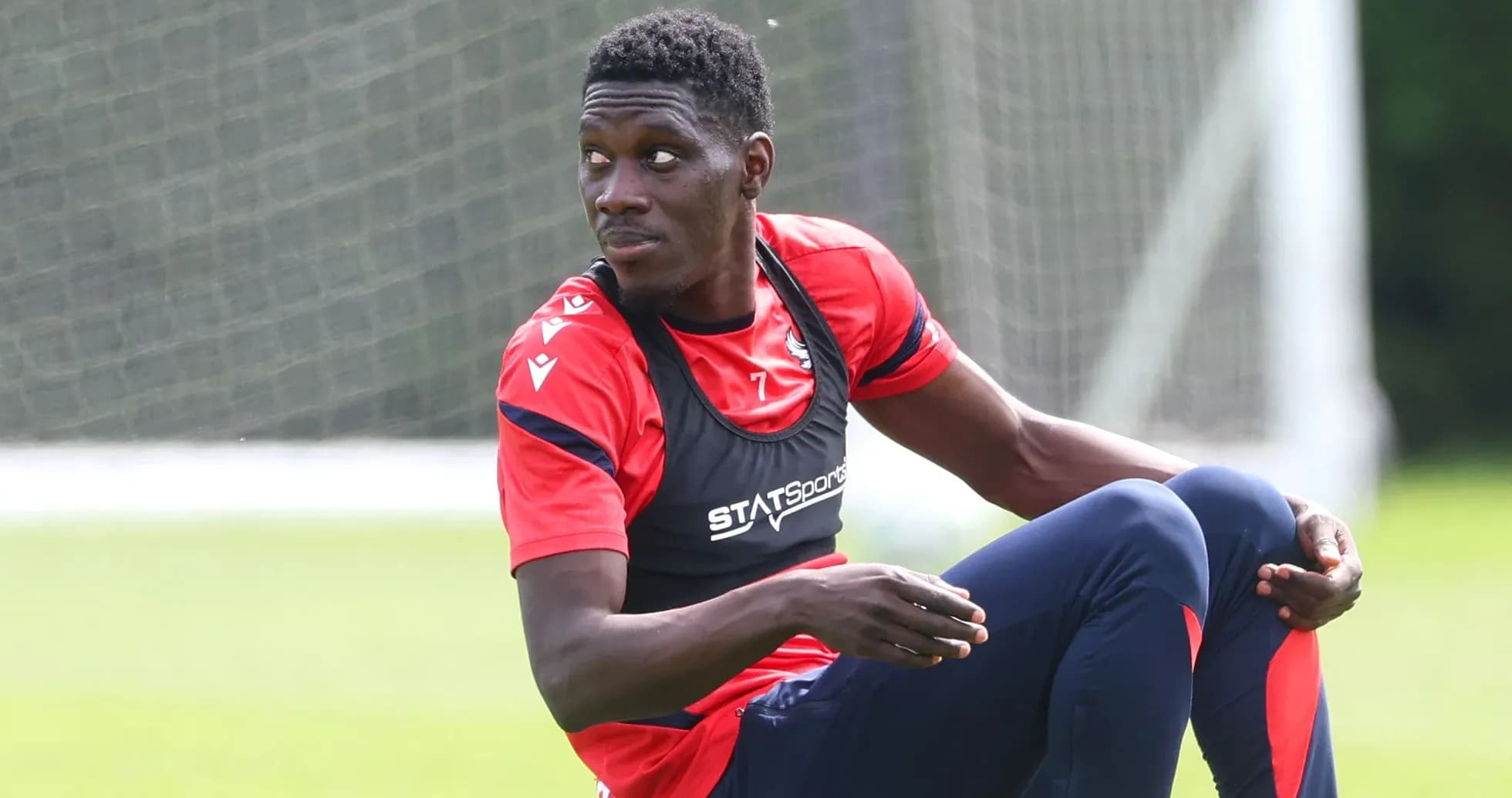 Player sitting on training ground during session
