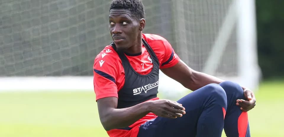 Player sitting on training ground during session