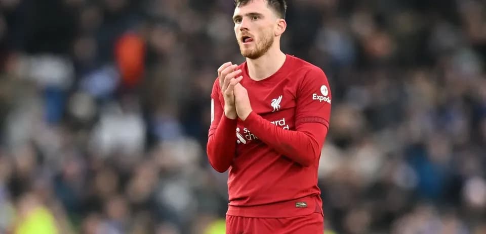 Liverpool player applauding fans after match